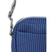 roka-bond-small-recycled-canvas-crossbody-bag---dark-denim-pinstripe-blue-34440166