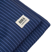 roka-chelsea-b-medium-recycled-canvas-sling-bag---dark-denim-pinstripe-blue-34440174