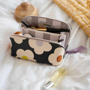 caroline-gardner-multi-flower-diagonal-wash-bag---blackcream-35903506